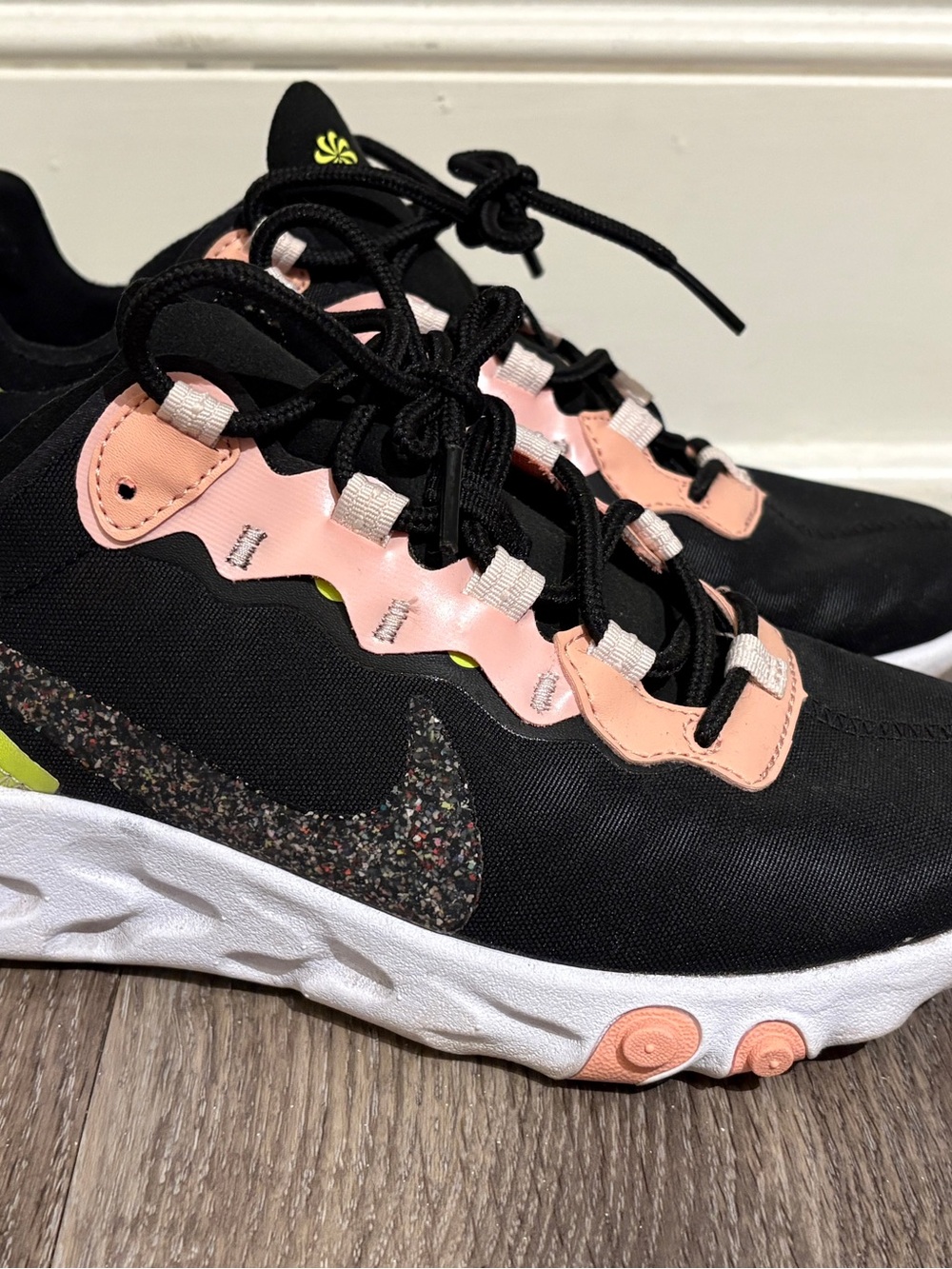 Nike Black Sneakers with Pink Accents and Speckled Swoosh